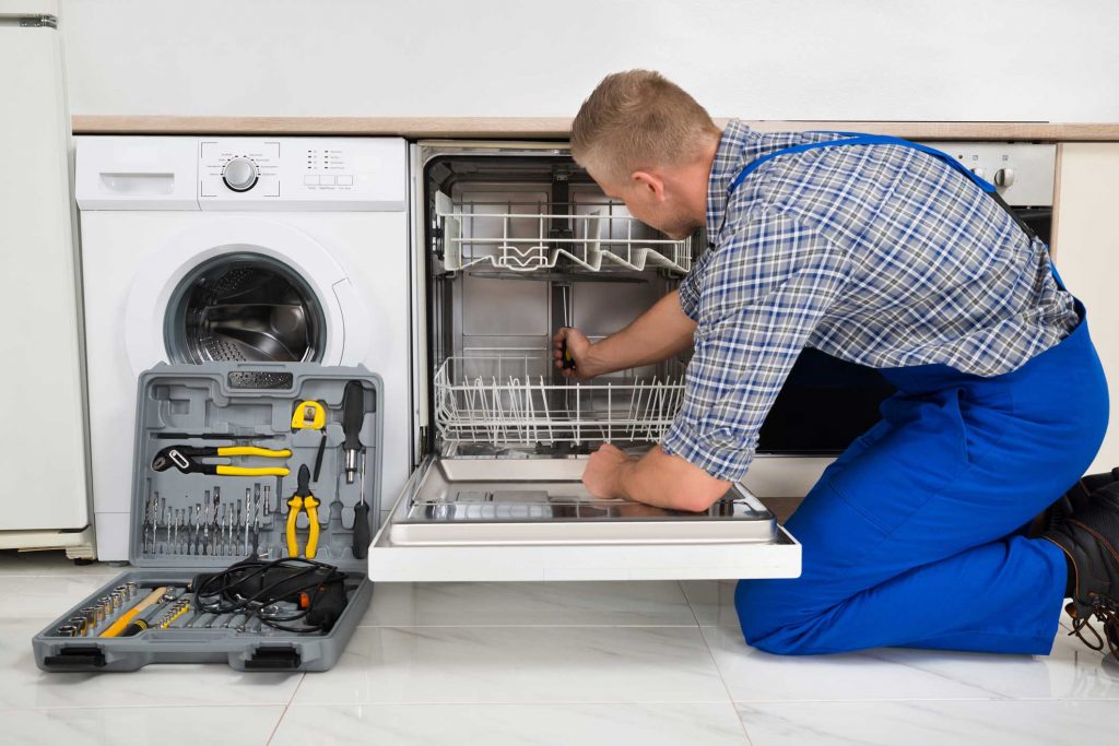 technician fixing a dishwasher repair mount pleasant